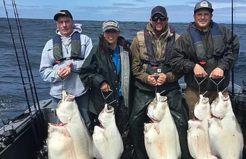 men posing with their catch of great halibut while fishing in Oregon